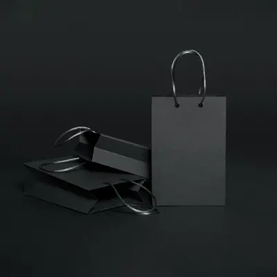 Black Paper Bags shown at an angle that reveals the depth of the pack
