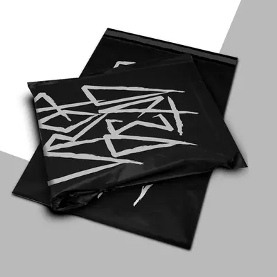 Black Poly Mailers shown at an angle that reveals the depth of the pack