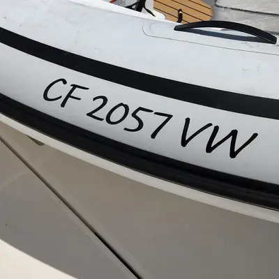 Boat Registration Number Stickers photographed from a second angle showing the side panel