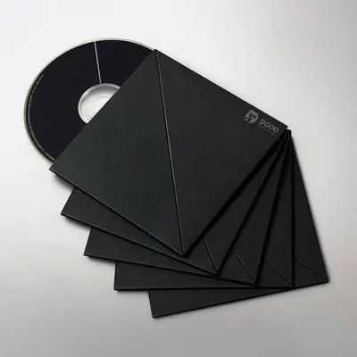 CD Sleeves presented alongside its printed surface detail