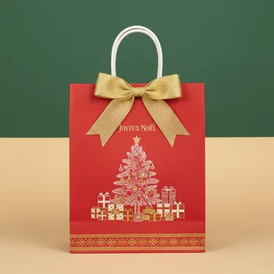 Christmas Paper Bags displayed with the closure detail visible