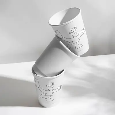 Custom Double Wall Paper Cups presented alongside its printed surface detail