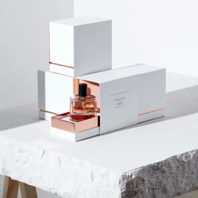 Custom Perfume Boxes with Inserts shown in a retail presentation setting