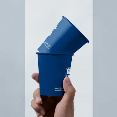 Personalised Paper Cups presented alongside its printed surface detail