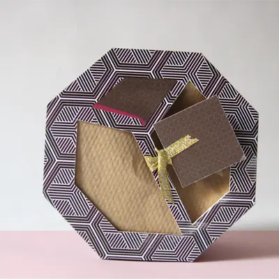Scarf Boxes presented alongside its printed surface detail