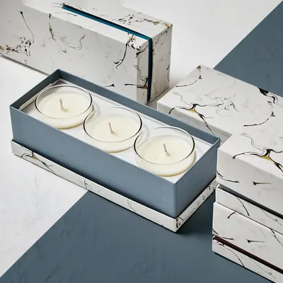 Tealight Boxes presented alongside its printed surface detail