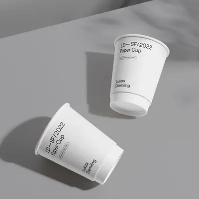 White Paper Cup presented alongside its printed surface detail